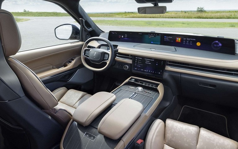 The front portion of the cabin of a 2025 Lincoln Black Label Navigator® SUV is shown in the Enlighten theme